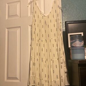 H&M Cream colored mini dress with black arrow pattern